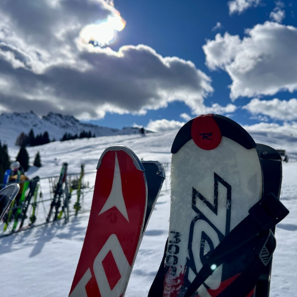 Tips of skis with sky behind.