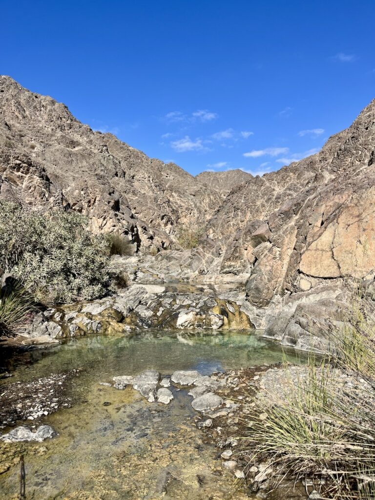 A small pool in a little gorge going up a mountain.